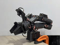ElRobot 7+1 DoF 3D-printed robot arm in matte black PLA, clamped to a desk